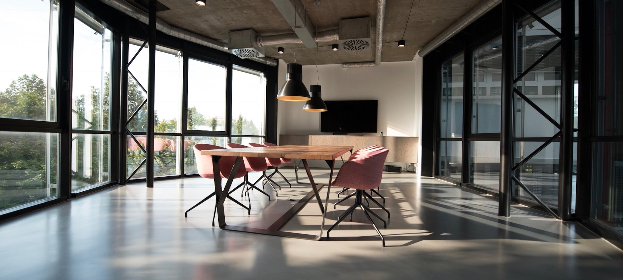 Completed modern corporate boardroom with floor-to-ceiling glazing